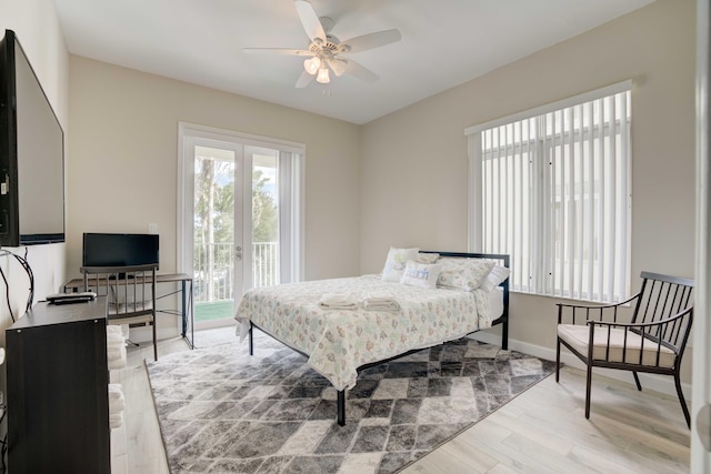 bedroom with ceiling fan and light hardwood / wood-style flooring