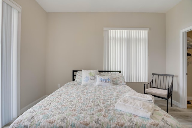 1203 Town Center Dr Unit 313, Jupiter, FL 33458 - bedroom with baseboards and wood finished floors