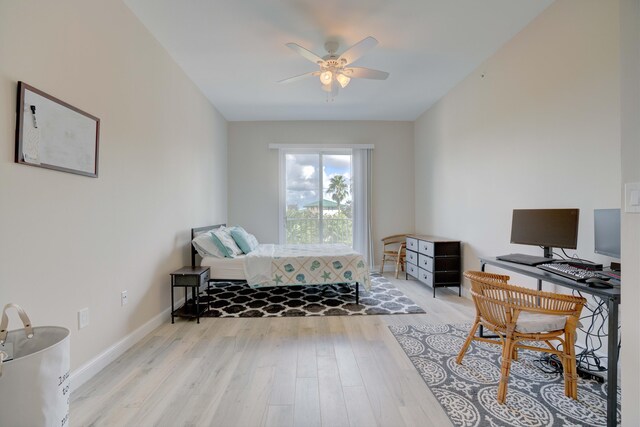 bedroom with ceiling fan and light wood-type flooring