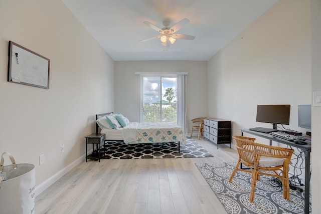 1203 Town Center Dr Unit 313, Jupiter, FL 33458 - bedroom with baseboards, ceiling fan, and wood finished floors