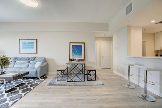 living room with light hardwood / wood-style flooring