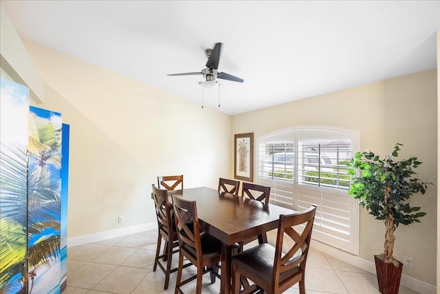 tiled dining area with ceiling fan