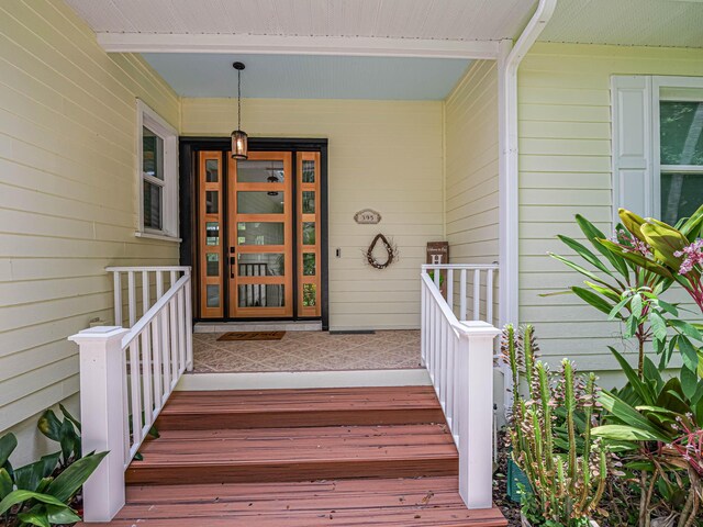 property entrance featuring covered porch