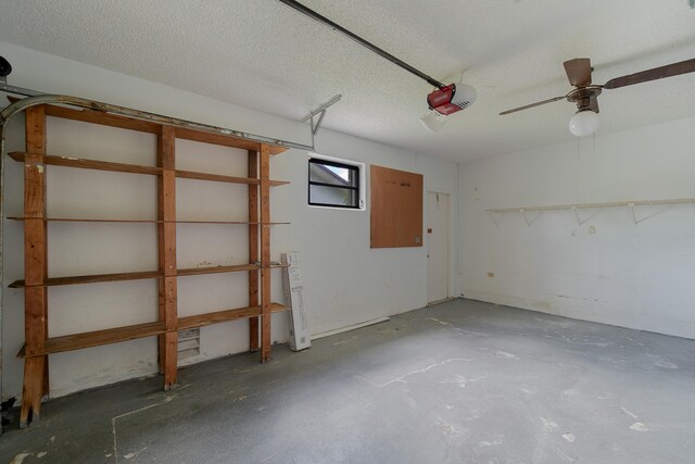 garage featuring ceiling fan and a garage door opener