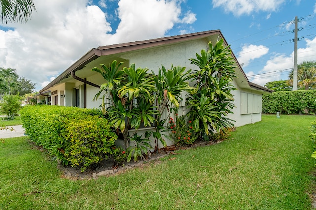 view of home's exterior featuring a lawn