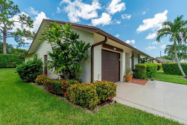 garage with a lawn