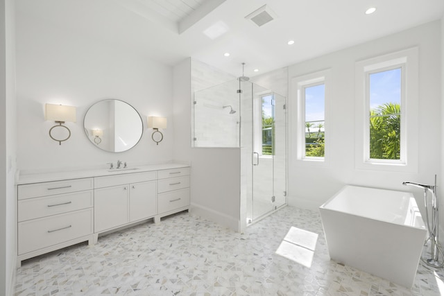 bathroom featuring shower with separate bathtub and vanity