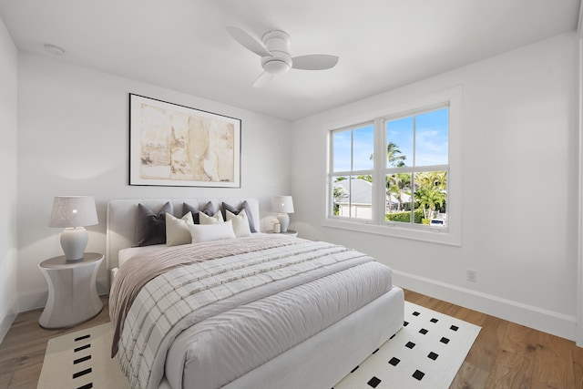 bedroom featuring hardwood / wood-style floors and ceiling fan