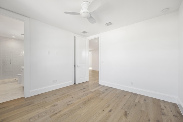 empty room featuring light wood-type flooring and ceiling fan