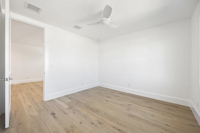 empty room featuring ceiling fan and light hardwood / wood-style flooring