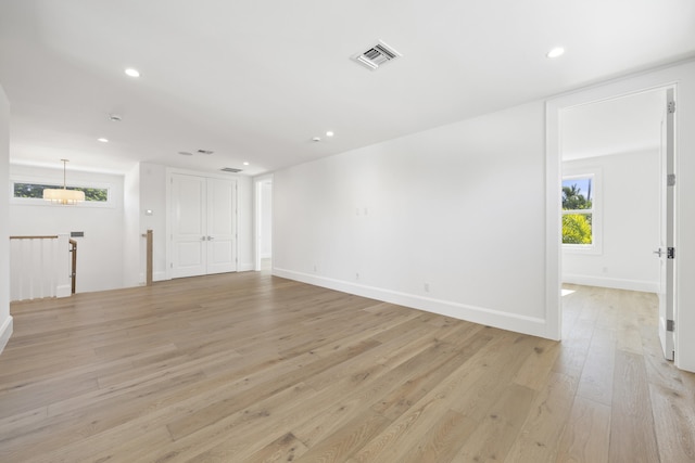 unfurnished living room with light hardwood / wood-style flooring