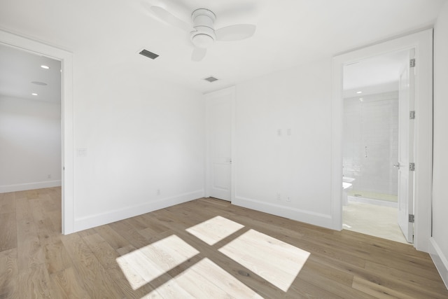 spare room featuring ceiling fan and light hardwood / wood-style floors