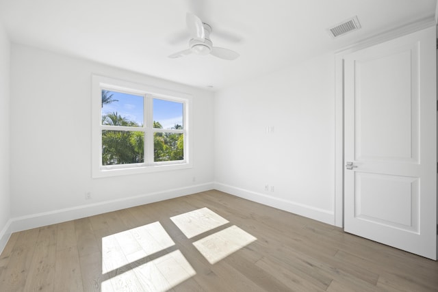 unfurnished room featuring ceiling fan and light wood-type flooring