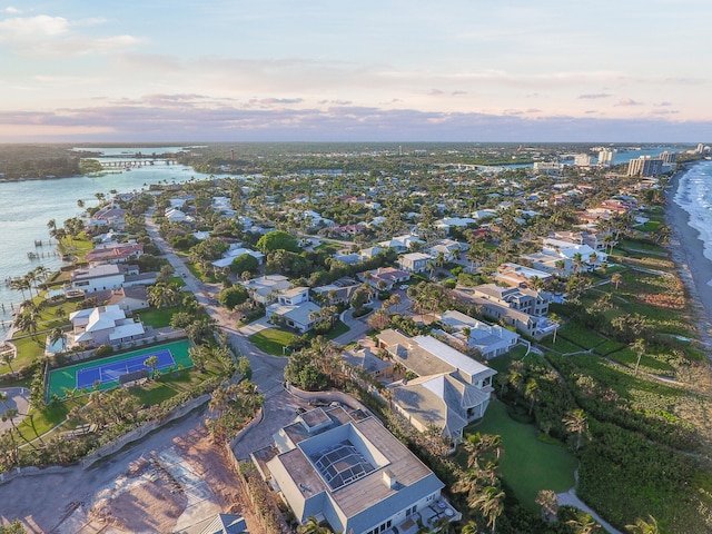 aerial view at dusk with a water view