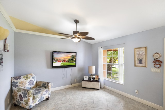 sitting room with ceiling fan and vaulted ceiling