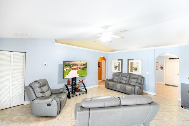 tiled living room featuring lofted ceiling, ceiling fan, and ornamental molding