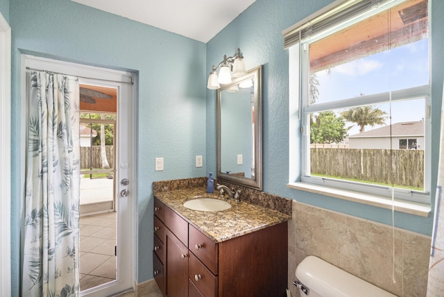 bathroom featuring toilet and vanity