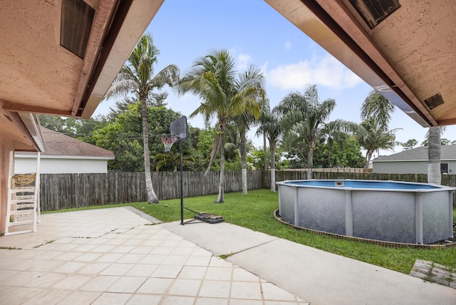 view of patio with a fenced in pool