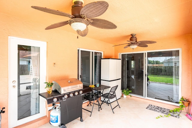 view of patio / terrace with ceiling fan and a grill