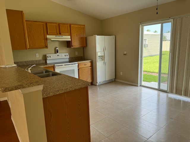 kitchen featuring white appliances, sink, kitchen peninsula, vaulted ceiling, and light tile patterned floors