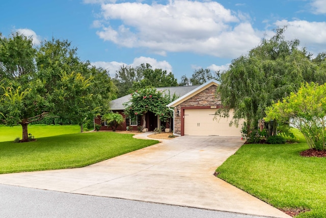 view of front of property featuring a garage, stone siding, concrete driveway, and a front yard