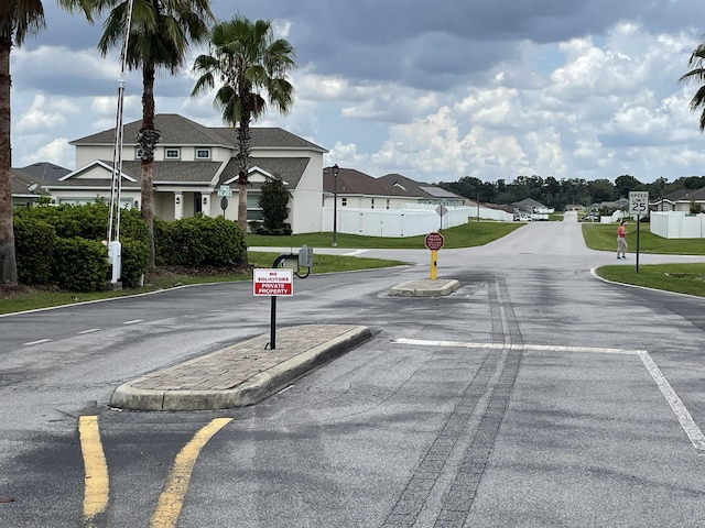 view of street featuring traffic signs and a residential view