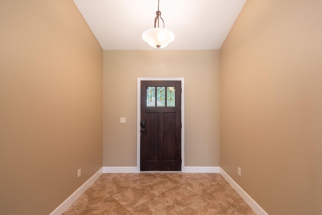 foyer entrance with baseboards