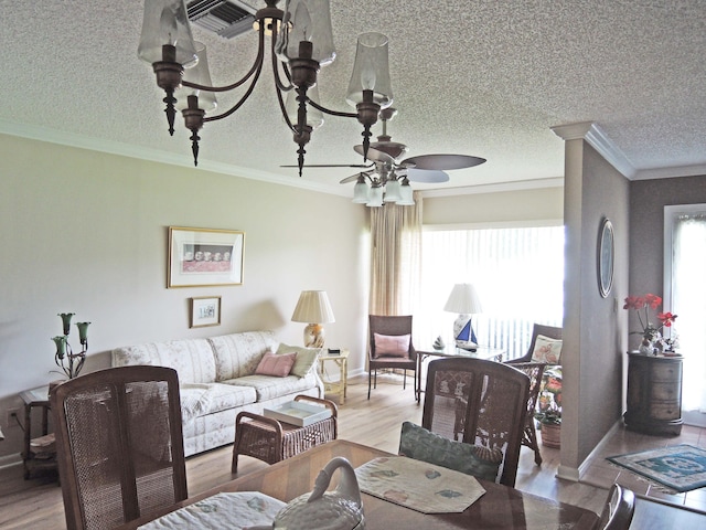 dining room featuring light hardwood / wood-style flooring, crown molding, and plenty of natural light