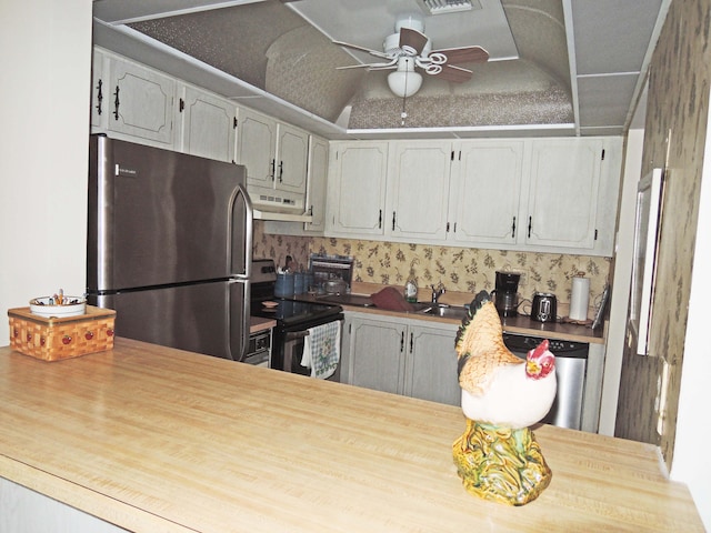 kitchen featuring sink, ceiling fan, and stainless steel appliances