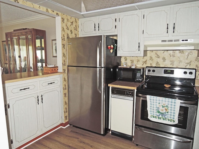 kitchen with white cabinetry, appliances with stainless steel finishes, a textured ceiling, range hood, and dark hardwood / wood-style flooring