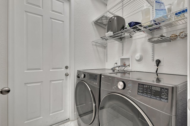 laundry room featuring separate washer and dryer