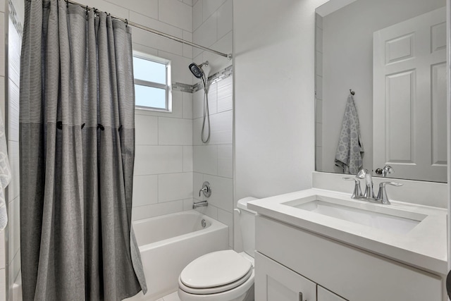 full bathroom with shower / bath combo, vanity, and toilet