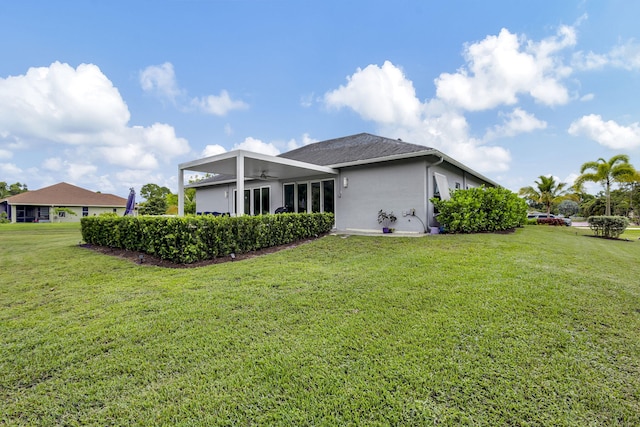 rear view of house with a lawn