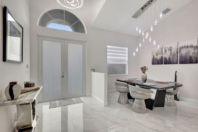 foyer entrance with light tile patterned flooring