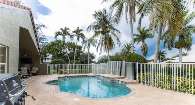 view of pool featuring a jacuzzi, a patio area, and area for grilling