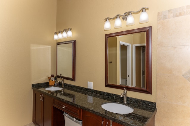 bathroom with dual vanity