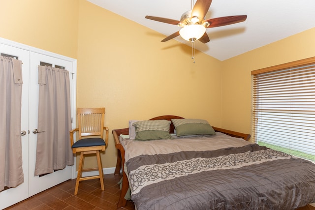 bedroom with ceiling fan and french doors