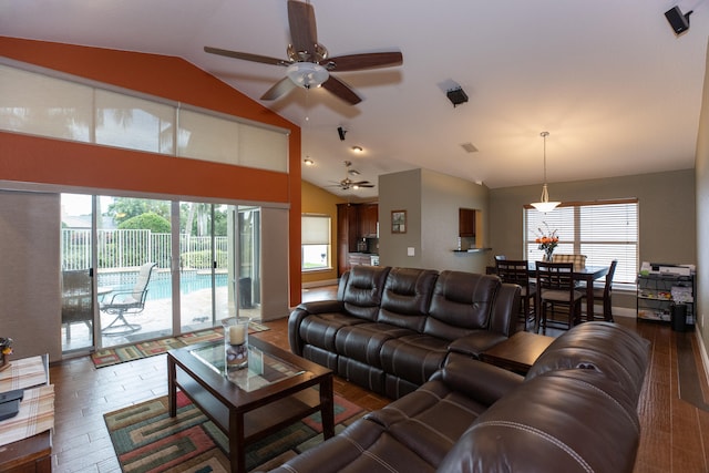 living room featuring ceiling fan, dark hardwood / wood-style flooring, and vaulted ceiling