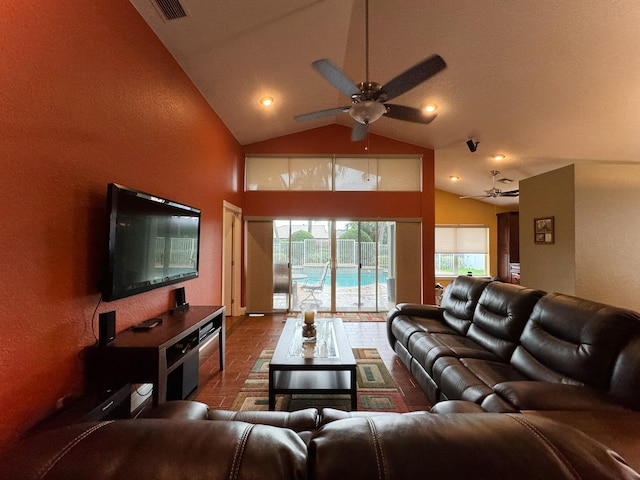 living room featuring ceiling fan and high vaulted ceiling