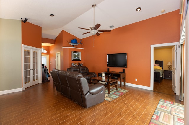 living room with ceiling fan, high vaulted ceiling, french doors, and wood-type flooring