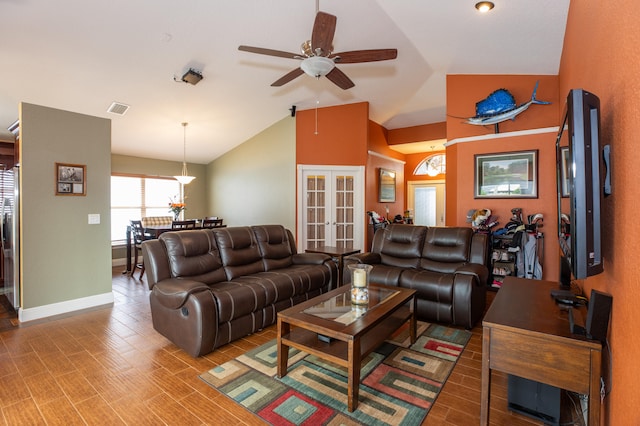 living room with hardwood / wood-style floors, french doors, vaulted ceiling, and ceiling fan