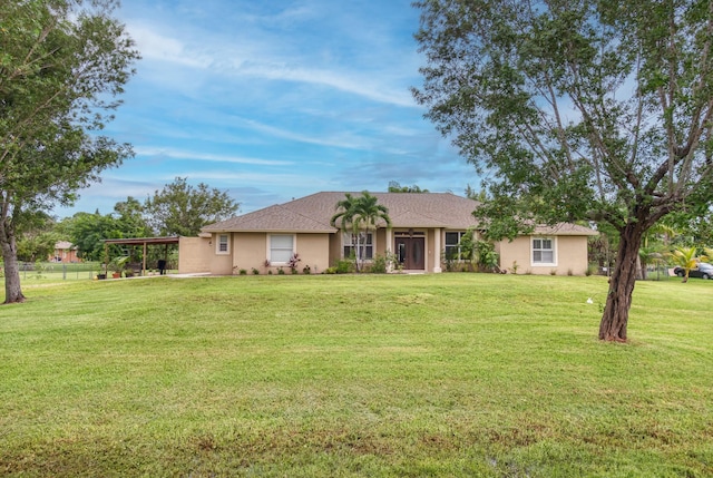 ranch-style home featuring a front lawn