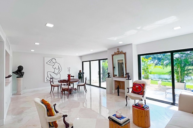 dining room with baseboards, french doors, and recessed lighting