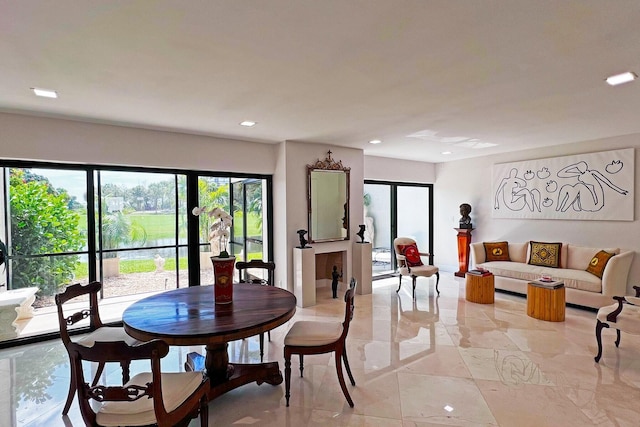 dining space with marble finish floor and recessed lighting