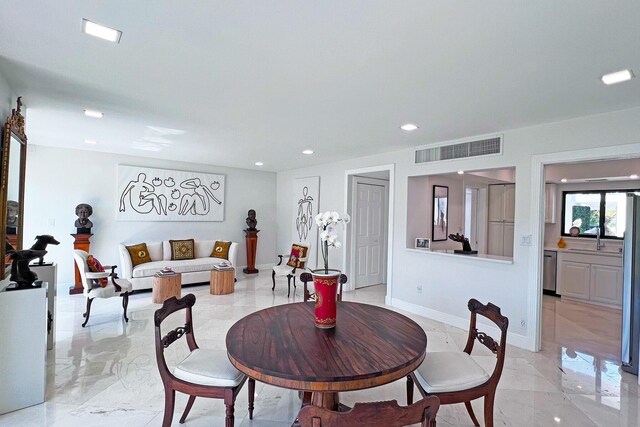 dining space featuring marble finish floor, recessed lighting, decorative columns, and baseboards