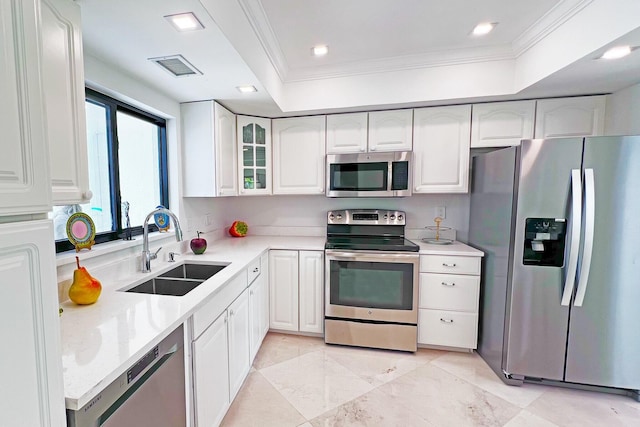 kitchen with visible vents, glass insert cabinets, appliances with stainless steel finishes, white cabinetry, and a sink