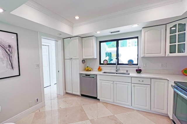 kitchen with white cabinetry, appliances with stainless steel finishes, light countertops, and a sink