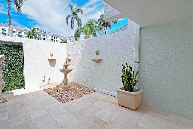 view of patio featuring fence