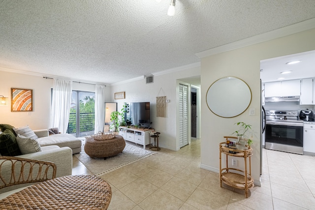 living room featuring a textured ceiling, light tile patterned flooring, and ornamental molding