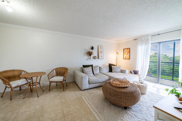 living room featuring light tile patterned floors, ornamental molding, and a textured ceiling